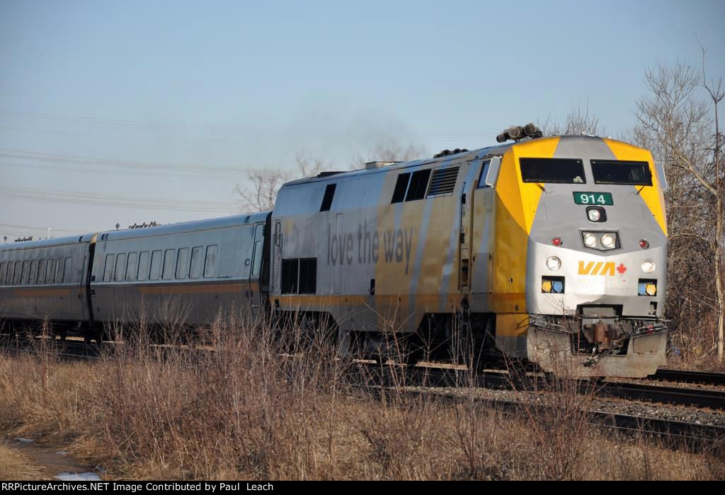 Passenger train eases west past the station